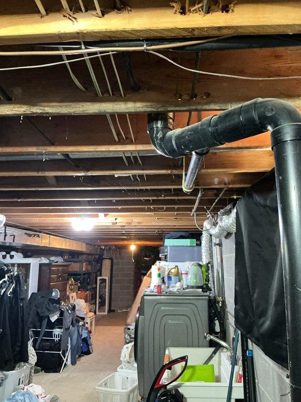 Installed new electrical outlet in fireplace area and ran wiring through basement ceiling joists for overhead light fixture in front room. Routed cables along existing joist structure, securing with appropriate fasteners, and verified all connections met code requirements for safe operation.