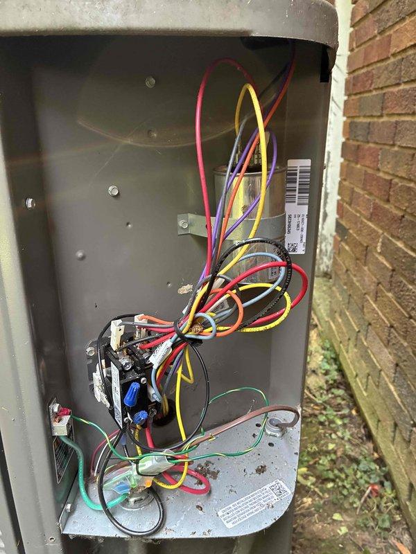 Completed comprehensive cooling maintenance on 2-year-old gas HVAC system. Inspected outdoor condenser unit, which showed significant dirt and debris accumulation on metal fins requiring attention. Evaluated electrical components including contactor, wiring connections, and outdoor disconnect panel, confirming all connections secure and operational despite visible weathering on enclosure exterior.