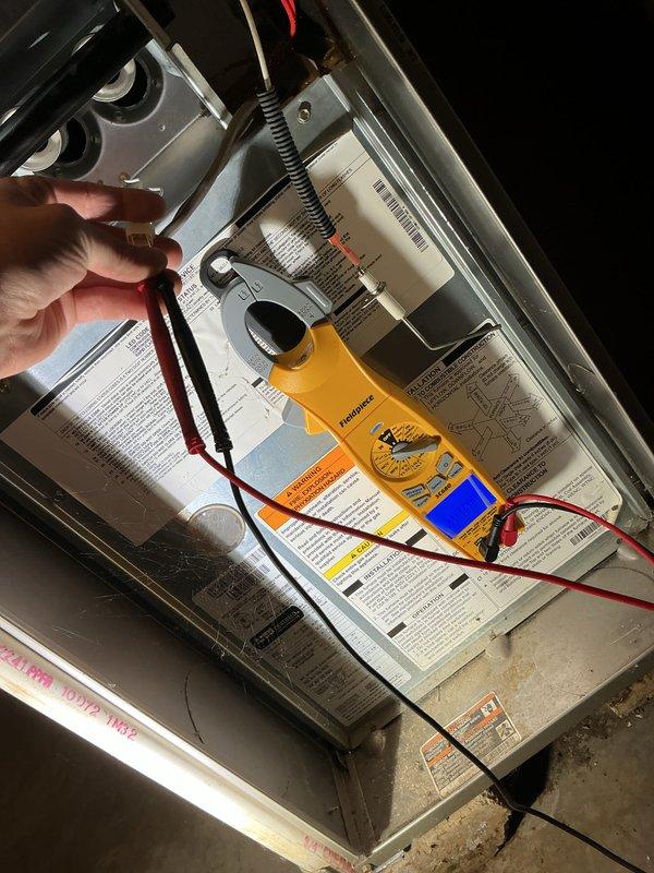 Completed scheduled maintenance on 13-year-old gas heating system. Performed electrical diagnostics using clamp meter to verify proper amperage draw and tested capacitor functionality, which measured 76.53 microfarads and within acceptable operating range. All components inspected and system operating normally with no immediate service needs identified.