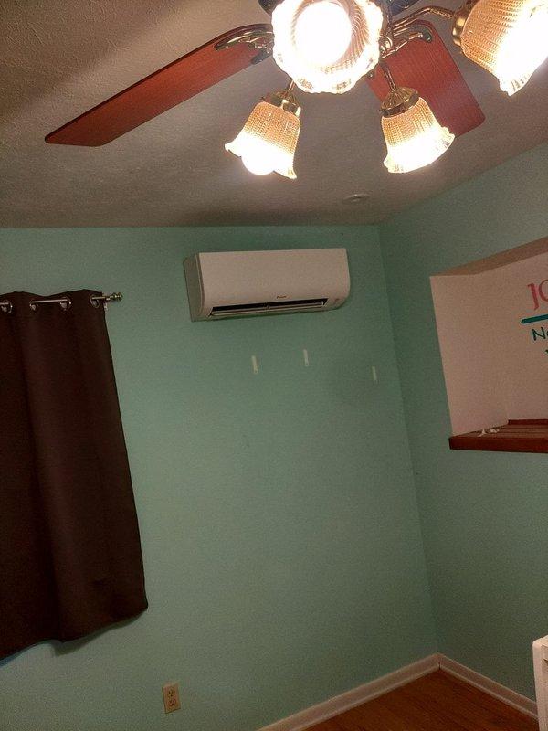 Completed installation of a four-head ductless mini-split system over a two-day period. Mounted interior air handler units in designated zones throughout the residence, including bedroom areas, with proper wall placement for optimal air distribution. Installed exterior condensing unit with line set routing along building exterior, secured all refrigerant lines and electrical connections, and commissioned system to verify proper operation of all zones.