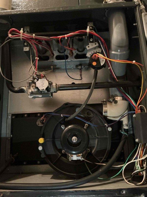 Performed comprehensive second opinion inspection on 18-year-old furnace system after another contractor diagnosed failed blower motor bearings, along with air conditioning contactor and capacitor issues. Conducted thorough visual and operational assessment of all furnace components including blower motor assembly, electrical connections, gas valve operation, and control board functionality. Upon detailed examination, found blower motor operating within normal parameters with no evidence of bearing failure, excessive noise, or vibration. All electrical connections secure and properly terminated, wiring harnesses intact with no signs of overheating or damage. Control board showing proper operation with all safety circuits functioning as designed. Gas valve assembly and burner components in satisfactory condition for age of unit. Documented system condition with detailed photographs of internal components, blower motor housing, electrical connections, and control systems. Provided homeow