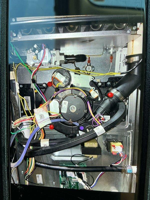 # No Heat Service Call - Gas Furnace

Responded to a no heat call for a 5-year-old gas furnace. Upon arrival, performed systematic diagnostic procedures to identify the cause of system failure.

Removed access panels and conducted visual inspection of all internal components, including blower motor assembly, electrical connections, and control wiring. Utilized digital multimeter to test voltage and continuity across key electrical components. Checked all wire harnesses and connector plugs for proper seating and signs of damage or corrosion.

Inspected blower motor, capacitor, and associated wiring for proper operation. Verified all safety switches and limit controls were functioning correctly. Examined control board connections and tested power supply to ensure proper voltage delivery to system components.

Traced all colored wire connections including yellow, red, white, and purple wires to verify proper circuit integrity. Checked all black hoses and tubing for proper connections and 