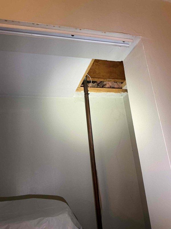 Responded to service call for non-functioning laundry room outlet and overhead light that had stopped working days apart. Accessed attic space through ceiling panel to troubleshoot electrical circuit serving both fixtures. Verified 120V power supply at circuit origin and traced wiring to identify failure point in the electrical pathway affecting multiple fixtures on the same branch circuit. Restored power to both the counter outlet and overhead light fixture, resolving the electrical issue.