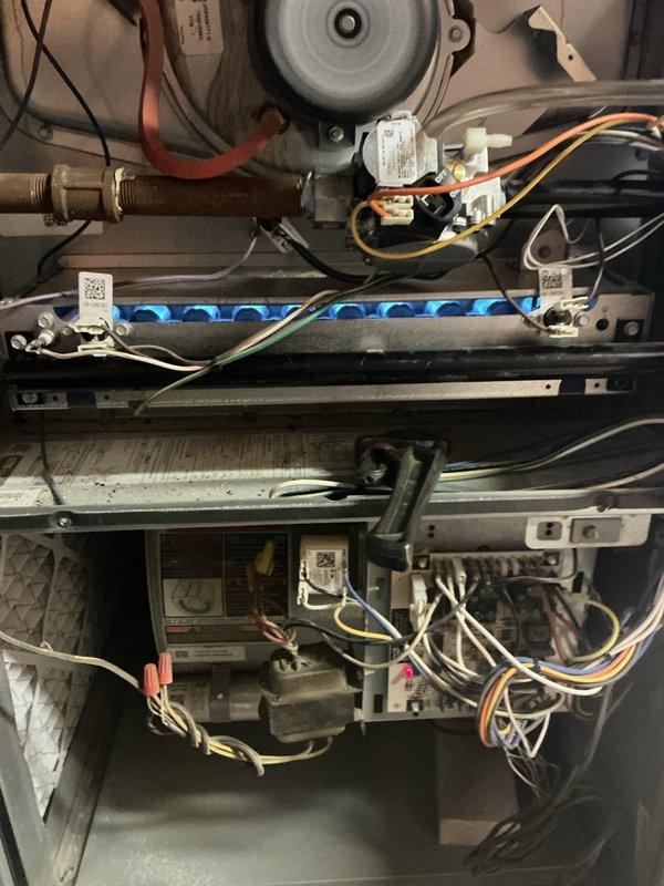 Responded to no-heat call on 10-year-old furnace. Upon arrival, performed diagnostic inspection of gas furnace system. Accessed interior components and conducted visual inspection of all major assemblies including blower motor, control board, wiring connections, and burner assembly.

Inspected burner assembly and confirmed proper flame ignition pattern with characteristic blue flames across burner rack. Verified gas valve operation and examined all electrical connections throughout the unit, including wire harnesses, connectors, and wire nuts for signs of looseness, corrosion, or damage. Checked control board for proper function and examined all safety switches and limit controls.

Tested system operation and confirmed furnace successfully ignited and cycled properly. System now heating normally with all components functioning as designed. Unit returned to full operational status.
