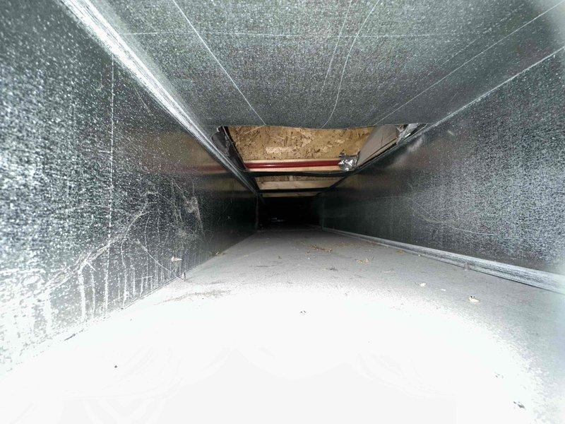 Completed comprehensive duct cleaning of residential HVAC system, accessing main trunk lines through access panels in finished basement area. Removed accumulated dust, debris, and particulate matter from interior ductwork surfaces, including metal seams, joints, and all accessible sections of the ventilation system. Installed customer-supplied Perfectpro 2025 air cleaner to improve overall air quality and system filtration efficiency.