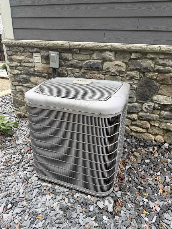Responded to service call for air conditioning unit experiencing intermittent shutdown issues requiring breaker reset to restore operation. Performed comprehensive system inspection of outdoor condenser unit and indoor blower assembly. Evaluated electrical connections, motor operation, and blower wheel condition. Documented equipment condition with photographic evidence showing outdoor condenser unit in good physical condition with no visible damage and indoor blower assembly with dust accumulation on motor housing and fan components. System components inspected for proper operation and potential causes of nuisance tripping including electrical faults, motor overload conditions, and airflow restrictions.