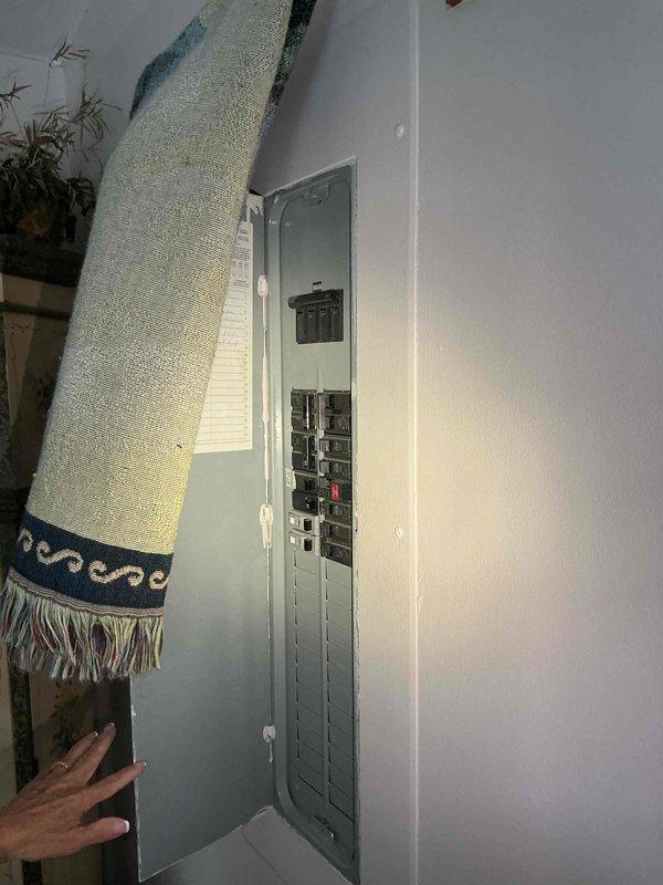 Conducted on-site evaluation of existing residential electrical service panel to assess feasibility and requirements for backup generator installation. Documented current electrical panel configuration, including main breaker capacity, available circuit positions, and overall panel condition to determine transfer switch compatibility and installation approach.