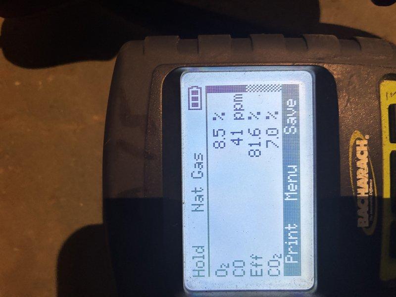 Completed MVP recurring heating maintenance visit. Performed system diagnostics using digital combustion analyzer, recording gas pressure readings and combustion efficiency parameters. Inspected evaporator coil assembly, confirming clean fins and proper airflow through curved coil section with no visible blockages or debris accumulation.