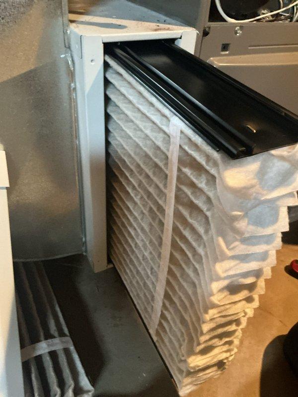 Completed comprehensive furnace tune-up including combustion analysis and air filtration system inspection. Verified proper operation with combustion analyzer readings showing stack temperature of 108°F, air temperature of 211°F, and monitored CO/CO2 levels to ensure safe and efficient operation. Inspected and evaluated pleated air filter condition within the air handling system to maintain optimal airflow and indoor air quality.