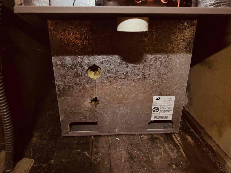 Responded to service call for 15-year-old furnace displaying pressure switch stuck open error code. Upon inspection, discovered extensive frost and ice crystallization throughout the unit's interior, covering the heat exchanger and evaporator coil surfaces. Diagnosed airflow restriction issue causing improper system operation and pressure switch failure. Cleared ice buildup, inspected heat exchanger for cracks, verified proper venting, and tested pressure switch operation. Unit returned to normal operating condition with proper airflow restored.