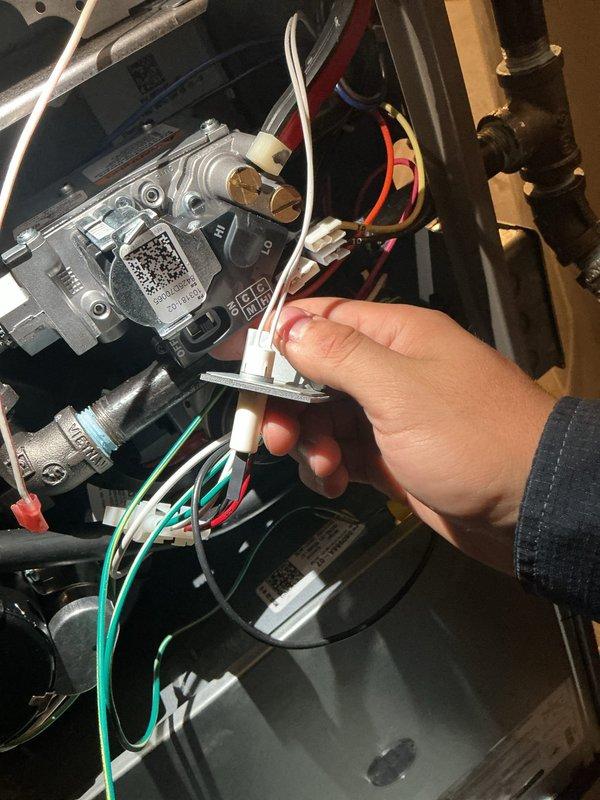 Completed scheduled MVP heating maintenance visit. Performed system diagnostics including electrical testing with multimeter to verify proper resistance readings and electrical continuity. Inspected and serviced gas valve assembly, checking wire connections and ensuring proper operation of the heating system components. Verified all electrical connections including the white connector harness with red and white wiring. Brought replacement filter as backup in case customer-purchased filter was incorrect size or specification.