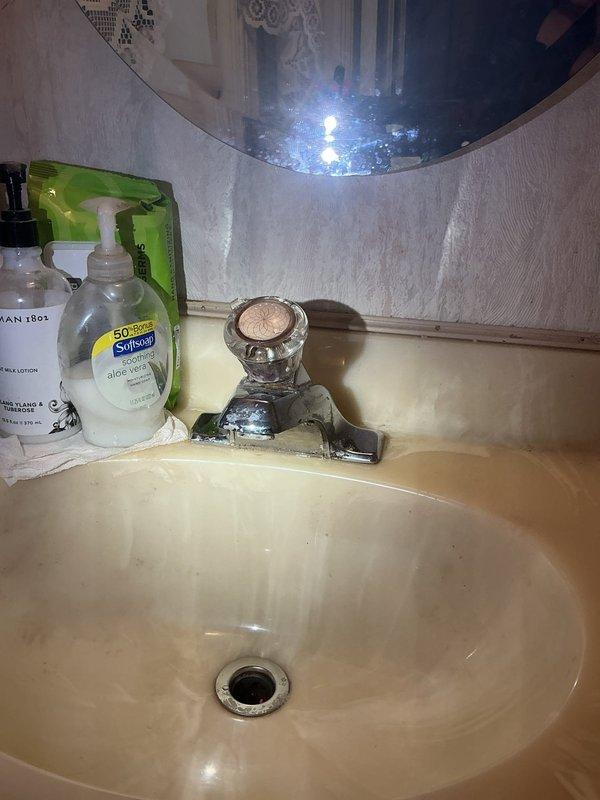 Responded to service call for bathroom sink pop-up drain assembly that was stuck in closed position and disconnected from lift rod mechanism. Upon inspection, found the pop-up stopper was inoperable due to disconnected pivot rod linkage beneath the sink. Disassembled the existing drain assembly, removed the faulty pop-up mechanism, and installed new pop-up drain assembly with proper pivot rod connection. Tested operation of lift rod and verified pop-up stopper now opens and closes smoothly, restoring full drain functionality to the bathroom sink.