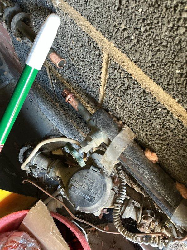 Removed old gate valves with missing handles in the laundry room and rebuilt the tees for the laundry hookup using new copper piping and fittings. Installed new hose bibs to replace the deteriorated fixtures. On the exterior side of the house, cut out the existing gate valve and installed a new frost-free sillcock with ball valve. Located and cut the abandoned 1/2" water line and properly capped it off to prevent future issues.