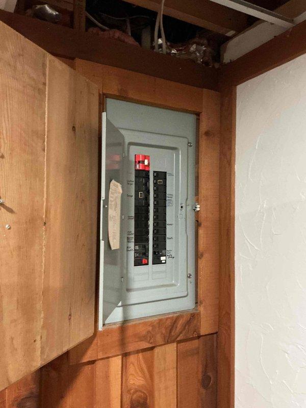 Conducted on-site electrical assessment for Kohler generator installation. Evaluated existing electrical panel configuration and circuit breaker arrangement to determine compatibility and capacity for generator integration. Documented current electrical infrastructure including panel condition, available breaker spaces, and wiring pathways through utility area for proper transfer switch placement and connection routing.
