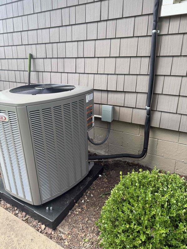 # HVAC Install - Complete System

Successfully completed installation of a horizontal 80,000 BTU air conditioning system in garage with open access configuration. Positioned and secured equipment in horizontal orientation using proper support methods to ensure stable mounting and optimal airflow. Ran electrical conduit from exterior wall to outdoor condensing unit, ensuring proper connection and code compliance. Installed outdoor condenser unit on rubber isolation pad with adequate clearance from building structure and landscaping. Verified all electrical connections, tested system operation with multimeter readings confirming proper voltage and amperage, and ensured all internal components including blower motor, control board, and refrigerant lines were functioning correctly. System commissioned and operational.