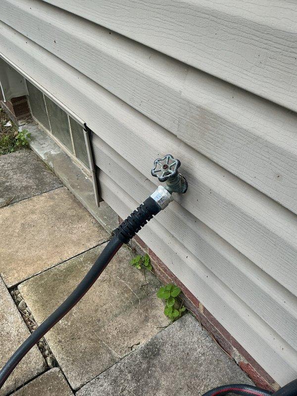 Conducted assessment of exterior plumbing system to provide estimate for replacement of pressure reducing valve and outdoor hose bib. Inspected existing outdoor spigot mounted on building exterior and performed water pressure testing using calibrated gauge to evaluate system performance. Documentation included pressure readings and current condition of outdoor faucet assembly and associated fixtures.