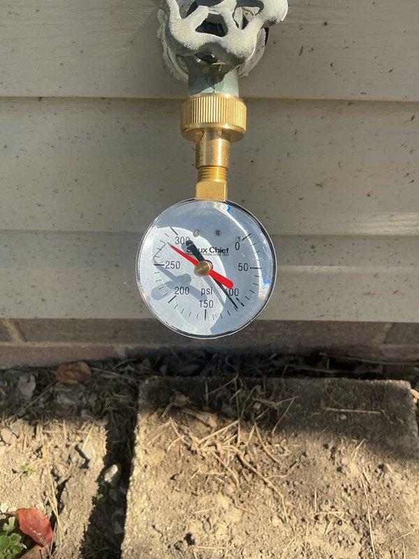 Conducted assessment of exterior plumbing system to provide estimate for replacement of pressure reducing valve and outdoor hose bib. Inspected existing outdoor spigot mounted on building exterior and performed water pressure testing using calibrated gauge to evaluate system performance. Documentation included pressure readings and current condition of outdoor faucet assembly and associated fixtures.