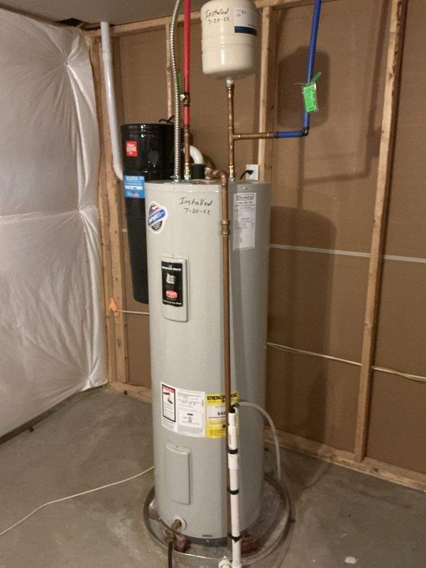 Performed routine maintenance flush on residential tanked water heater installed in 2022. Drained sediment buildup from tank bottom through drain valve, flushed system with fresh water until discharge ran clear, and refilled tank completely. Verified all plumbing connections, expansion tank, and pressure relief valve for proper operation. Inspected copper piping, PEX connections, and circulation pump for leaks or signs of wear. System restored to normal operation with no issues identified.