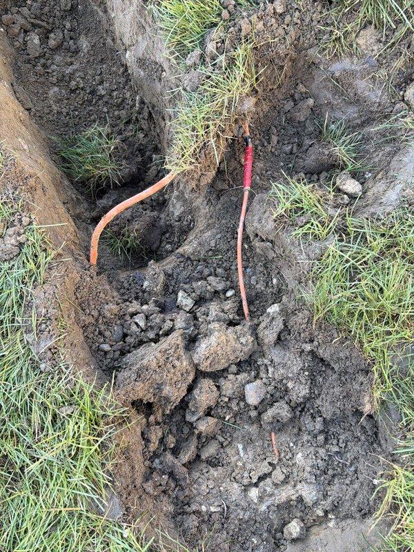 Retrenched power supply to front yard post light by excavating and installing PVC conduit along the existing pathway from the front office outlet to the light fixture, providing enhanced protection and durability for the underground electrical run. Replaced an overheating air conditioning circuit breaker in the main electrical panel to restore safe operation and prevent potential fire hazards.