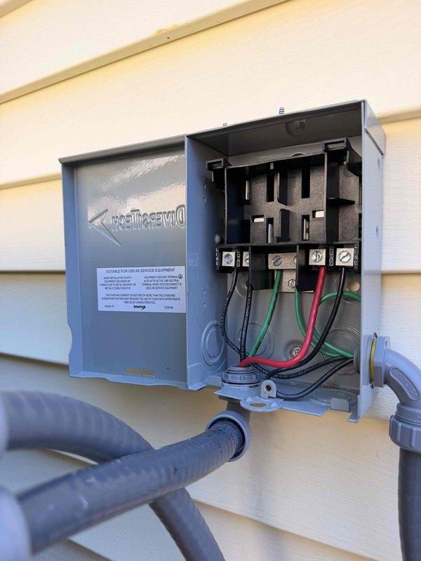 Completed changeout of existing mini split system to new 2-ton Daikin hyper heat unit, model DXT24AAVU2, utilizing R32 refrigerant. Installed outdoor condenser section with proper electrical disconnect and wiring connections, verified all safety labels and manufacturer specifications are visible and compliant, and removed old unit from premises for return to shop.