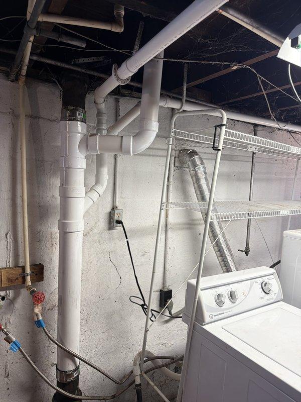 Replaced the main plumbing stack with new PVC piping in the basement utility area. Installed a new toilet line and flange, then reconnected all components to the existing plastic drainage system. All connections were secured and tested to ensure proper drainage function.