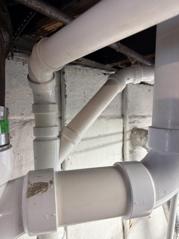 Replaced the main plumbing stack with new PVC piping in the basement utility area. Installed a new toilet line and flange, then reconnected all components to the existing plastic drainage system. All connections were secured and tested to ensure proper drainage function.