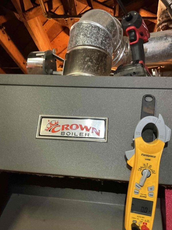 Responded to no-heat call on Crown boiler system installed in 2016. Upon arrival, confirmed thermostat was displaying but unit failed to ignite with no pilot light present. Performed diagnostic testing using multimeter to check electrical components and system controls. Inspected boiler circulator pump, zone valves, and associated piping for proper operation. Tested ignition system, flame sensor, and gas valve functionality to identify failure point. Restored heat to the residence and verified proper system operation before departure.