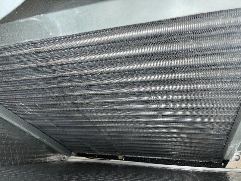 Completed scheduled MVP heating maintenance visit on residential HVAC system. Performed thorough inspection of heat exchanger components, examining multiple parallel metal fins and evaporator coils for proper condition and thermal transfer efficiency. All components showed normal wear patterns with no significant damage, corrosion, or excessive debris accumulation noted. System operational and functioning within normal parameters.