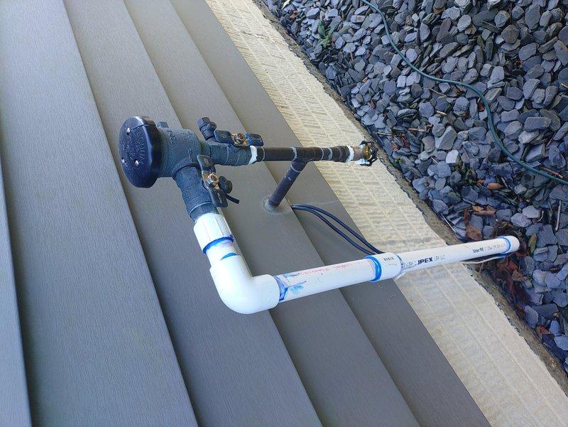 Responded to low water pressure complaint regarding DAB Esybox mini booster pump installed approximately three months prior. Customer reported inadequate performance affecting in-ground sprinkler system operation. Upon arrival, conducted visual inspection of exterior booster pump installation and associated PVC piping configuration. Verified mounting hardware and backflow preventer assembly condition. Checked system pressure gauge readings and evaluated pump performance parameters. Inspected brass fittings, compression connections, and valve assemblies for proper operation. Assessed pump control settings and pressure switch calibration. Documented current system configuration with photographs showing exterior wall-mounted installation and pressure gauge assembly. Verified electrical connections and pump cycling operation. System evaluation completed to determine cause of reduced water pressure and diminished sprinkler performance compared to initial installation standards.