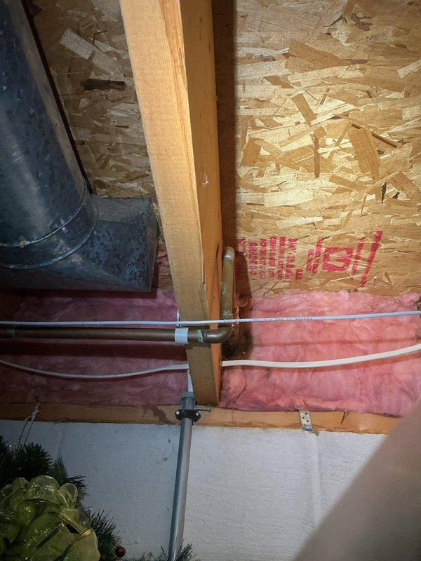 Completed repair of leaking outdoor hose bib that was spraying water at the exterior wall penetration. Accessed interior crawl space to replace failed valve assembly and secure copper supply line. Tested system under full pressure to confirm leak elimination and proper operation of the outdoor spigot.