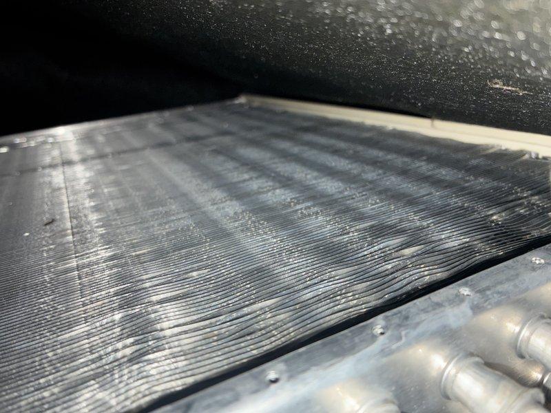 Completed scheduled maintenance on 6-year-old air conditioning system and 1-year-old furnace. Inspected evaporator coil assembly, which showed normal condensation buildup during operation, indicating proper cooling function. Verified refrigerant lines, fin spacing, and overall system cleanliness with no issues identified.