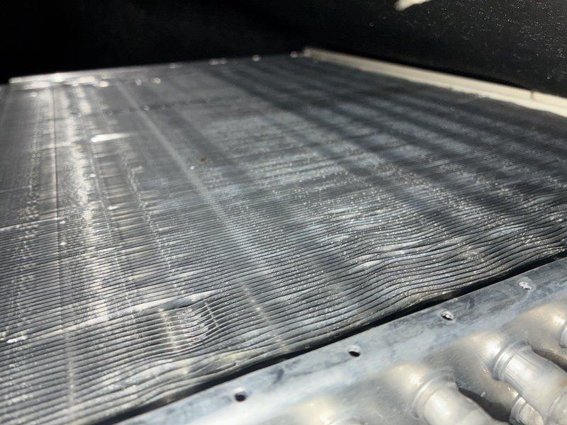 Completed scheduled maintenance on 6-year-old air conditioning system and 1-year-old furnace. Inspected evaporator coil assembly, which showed normal condensation buildup during operation, indicating proper cooling function. Verified refrigerant lines, fin spacing, and overall system cleanliness with no issues identified.