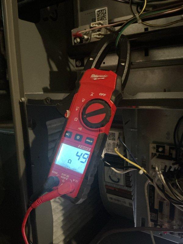 # Furnace Tune-Up Completed

Performed comprehensive preventive maintenance on a 3-year-old gas furnace. Conducted electrical diagnostics using digital multimeter to verify proper voltage and resistance readings across control board components, measuring 45 ohms on critical circuit paths. Inspected and tested all electrical connections, including control board relays, capacitors, and terminal blocks. Verified proper operation of all safety controls and confirmed secure wire routing throughout the equipment cabinet. All systems tested and operating within manufacturer specifications.