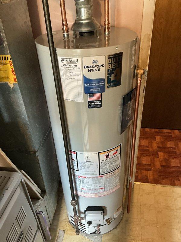 Replaced leaking 2018 40-gallon tall water heater with new Bradford White 40-gallon tall unit featuring 10-year manufacturer warranty. Installed new shut-off valve and expansion tank tee due to proximity constraints at top of tank, added required bonding wire for code compliance, and included 4-year extended warranty coverage with maintenance value plan.