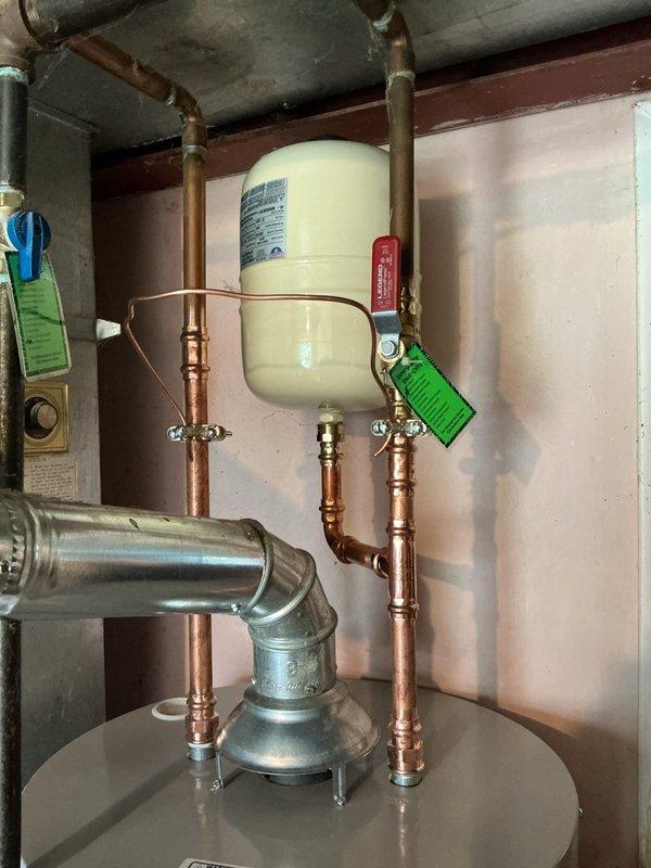Replaced leaking 2018 40-gallon tall water heater with new Bradford White 40-gallon tall unit featuring 10-year manufacturer warranty. Installed new shut-off valve and expansion tank tee due to proximity constraints at top of tank, added required bonding wire for code compliance, and included 4-year extended warranty coverage with maintenance value plan.