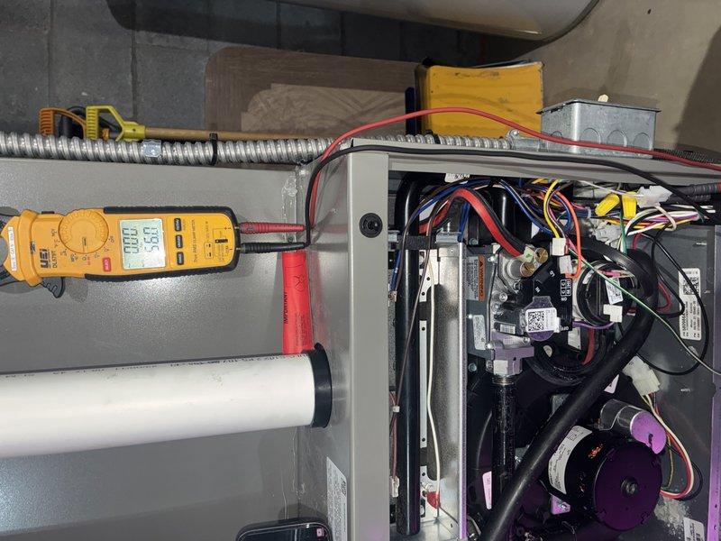 Performed comprehensive heating maintenance on residential gas furnace system. Conducted diagnostic testing of electrical components using digital multimeter to verify proper voltage and amperage across control board and safety circuits. Inspected blower motor assembly, wiring connections, and all internal mechanical components. Verified proper operation of control module, relay switches, and thermostat connections. All colored wire terminals were secure with no signs of overheating or corrosion. Tested system startup sequence and confirmed unit is operating within manufacturer specifications. No deficiencies noted; system is functioning properly for continued heating season operation.