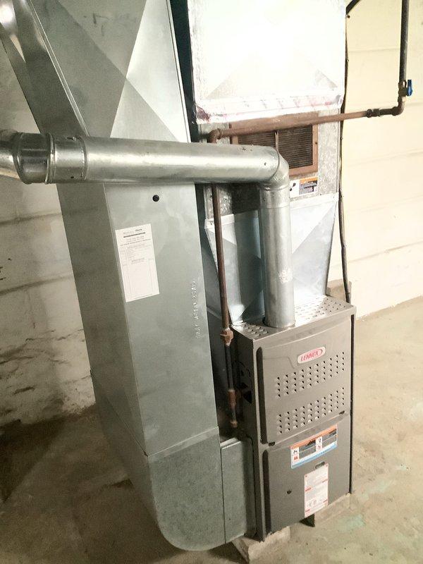 Disconnected existing spider duct configuration and installed new trunk line to accommodate reconfiguration across block wall partition. Completed duct runs on opposite side of wall, cutting and fitting remaining branch lines to ensure proper airflow distribution throughout the system. All ductwork properly sealed and secured to Lennox furnace unit with galvanized steel trunk and flex duct connections verified for optimal HVAC performance.