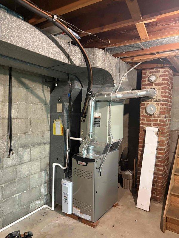Completed second furnace installation as part of an 80% efficiency HVAC system upgrade. Installed new residential furnace unit in basement mechanical room with proper venting connections, ductwork integration to existing distribution system, and PVC condensate drainage. Mounted and installed Kidde carbon monoxide alarm per code requirements to ensure safe operation of combustion equipment.
