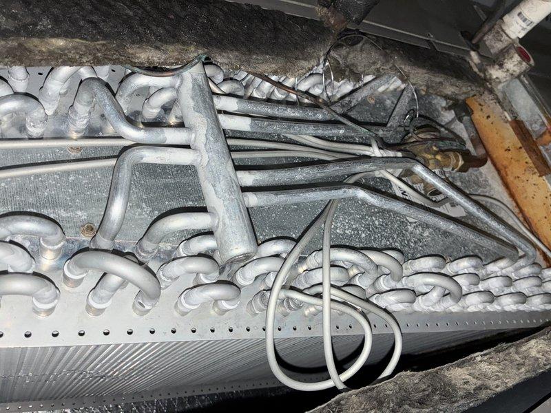 Performed comprehensive tune-up on 8-year-old Lennox ML195UH070XP36B gas furnace. Inspected evaporator coil, verified refrigerant lines and electrical connections were secure, checked condensate drain system for proper operation, and confirmed all components functioning within manufacturer specifications. Unit operating efficiently with no issues identified.