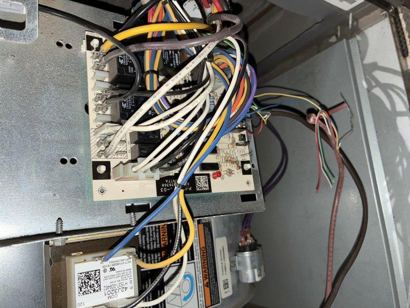 Completed comprehensive MVP heating maintenance on HVAC system. Performed thorough inspection of furnace control board, verified all electrical connections and relay operations, and examined system components including capacitor and wiring harnesses. Removed and inspected air filter assembly and ventilation components, cleaned accumulated dust and debris from filter housing and decorative register grate, then reassembled all components to ensure proper airflow and system functionality.