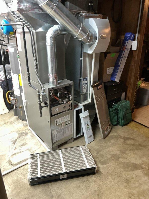 Completed preventive maintenance on residential gas furnace system. Performed comprehensive inspection of all major components including heat exchanger, burner assembly, and blower motor. Verified electrical readings with multimeter, confirming proper voltage at 176.7V to blower motor. Inspected control board connections and wiring harnesses for secure terminations. Checked blower motor operation and fan assembly for proper function. Replaced air filter with new pleated media filter. Inspected ductwork connections and ventilation components. Verified proper operation of safety controls and thermostat communication. System tested and left in normal operating condition.