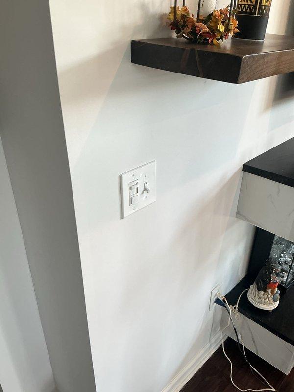 Installed three white Decora-style slider dimmer switches to control kitchen island lights, kitchen can lights, and living room can lights. Replaced wall plate covers for two switch boxes with new combination plates: one toggle/decora/decora configuration and one toggle/decora configuration to accommodate the new dimmer switches and existing toggle switches.