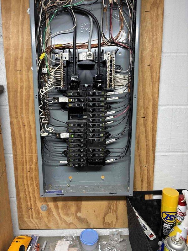 Installed dedicated electrical circuit for tankless water heater system. Ran new wiring from main electrical panel through basement utility area to tankless unit location, securing conductors properly along floor joists and through insulated crawl space. Installed appropriate circuit breaker in main service panel and completed all electrical connections per manufacturer specifications and local electrical code requirements for tankless water heater installation.