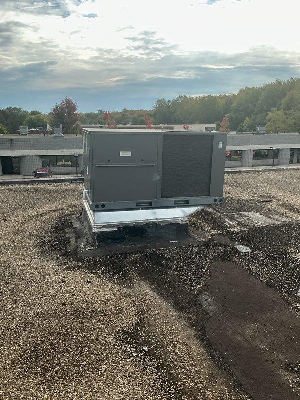 Responded to no cooling complaint on rooftop-mounted commercial HVAC unit. Upon arrival, accessed unit through top panel and inspected internal components including air handler, ductwork, and electrical connections. Unit appeared to be in serviceable condition with proper insulation and wiring intact. Verified unit operation and completed visual inspection of exterior casing, mounting platform, and drainage lines on gravel roof surface.