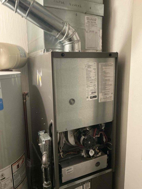 Completed scheduled MVP heating maintenance visit on residential forced-air furnace system. Performed comprehensive inspection of gas furnace unit and associated components, including blower motor assembly, electrical connections, and internal mechanical systems. Accessed lower furnace panel to examine wiring harnesses, burner assembly, and safety controls. Verified proper operation of heating equipment, checked gas piping connections for integrity, and inspected ductwork connections. Confirmed 16x20x2 filter specification marking on unit. System found operating within normal parameters with all components functioning properly.
