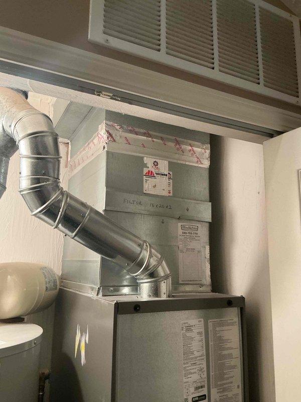 Completed scheduled MVP heating maintenance visit on residential forced-air furnace system. Performed comprehensive inspection of gas furnace unit and associated components, including blower motor assembly, electrical connections, and internal mechanical systems. Accessed lower furnace panel to examine wiring harnesses, burner assembly, and safety controls. Verified proper operation of heating equipment, checked gas piping connections for integrity, and inspected ductwork connections. Confirmed 16x20x2 filter specification marking on unit. System found operating within normal parameters with all components functioning properly.