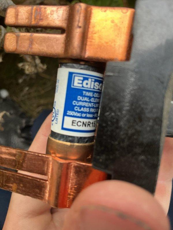 Completed MVP recurring cooling and heating maintenance visit. Inspected and photographed HVAC system components including copper refrigerant lines, electrical fuse assembly (Edison ECNR15 dual-element class RK1), rooftop unit with parallel refrigeration tubing, control panel with circuit breakers, and associated wiring connections. All equipment operational with normal wear patterns observed; system functioning within specifications.