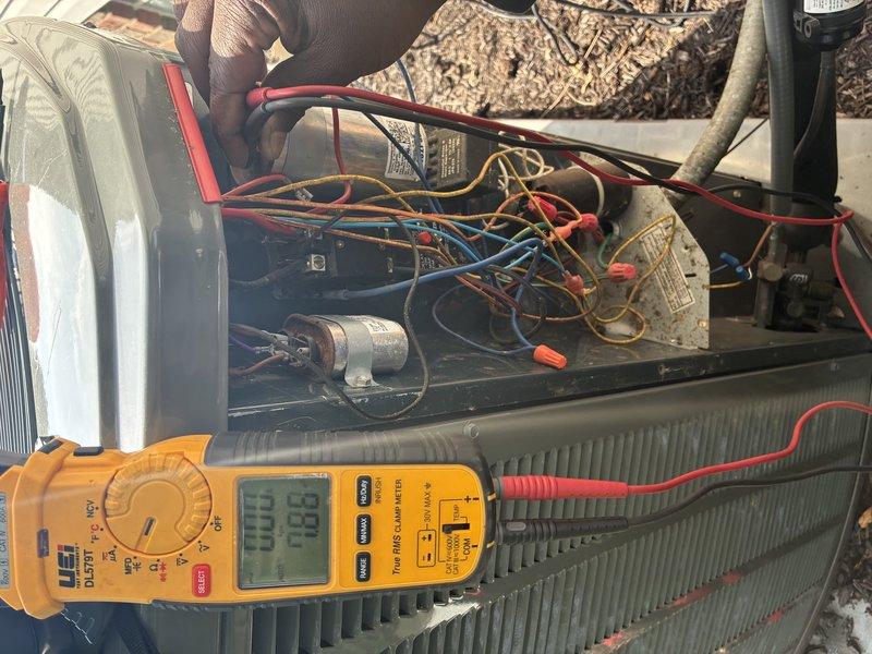 # HVAC Maintenance - Cooling

Performed comprehensive maintenance service on an 8-year-old air conditioning system. Conducted electrical diagnostics using digital multimeter to verify proper voltage and amperage readings at contactor and capacitor connections. Inspected condenser coil condition, electrical wiring integrity, and all terminal connections. All components found to be operating within normal parameters with no immediate repairs required.