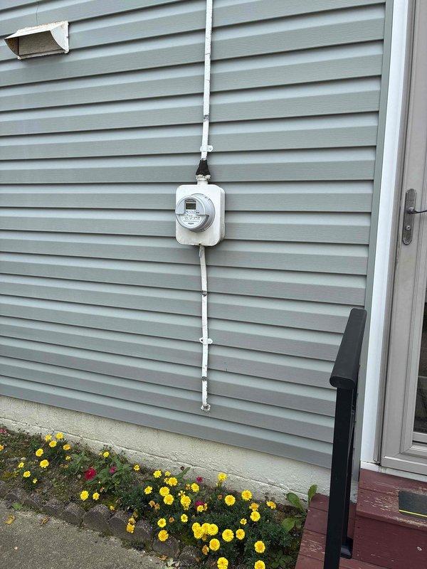 Responded to service call regarding flickering lights in residence. Performed comprehensive electrical panel inspection and diagnosed wiring issues requiring attention. Inspected basement electrical infrastructure including exposed conduit runs and junction boxes, identifying areas with aged wiring and connections contributing to the flickering condition. Verified proper grounding at exterior meter base and evaluated service entrance conductors for integrity. Addressed electrical deficiencies found during panel inspection, secured all connections, and confirmed proper circuit loading to resolve flickering issue and ensure safe, reliable operation of the electrical system.