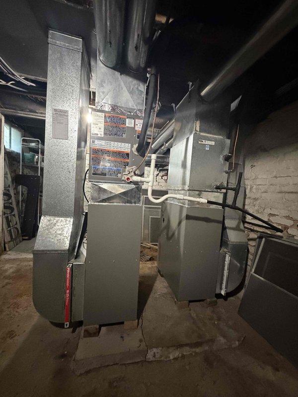 # HVAC Install - Furnace

Successfully completed the installation of two 80% efficiency Lennox furnaces in residential basement mechanical room. Both units were installed side by side with proper clearances and connected to existing ductwork system. Configured supply and return air pathways using insulated flexible ductwork and metal plenums. All electrical connections were completed per manufacturer specifications and local code requirements. Units were mounted on concrete floor with appropriate leveling and secured in compliance with installation standards. Ductwork connections were sealed and insulated to prevent air leakage and ensure optimal system efficiency. Both furnace units were tested for proper operation, airflow, and safety controls. System startup procedures were performed on each unit to verify proper ignition sequence, flame sensing, and blower operation. Installation included proper labeling and documentation affixed to equipment as required by code.